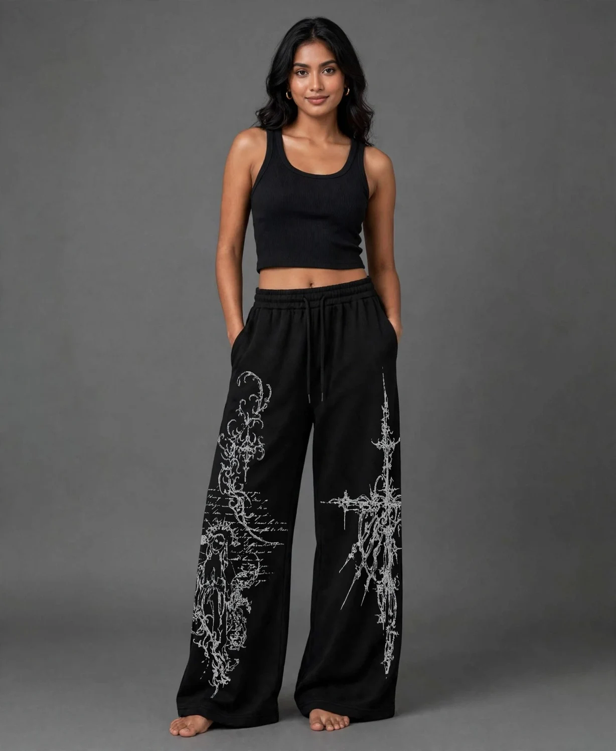 Black wide-leg pants with white gothic cross and filigree graphic print