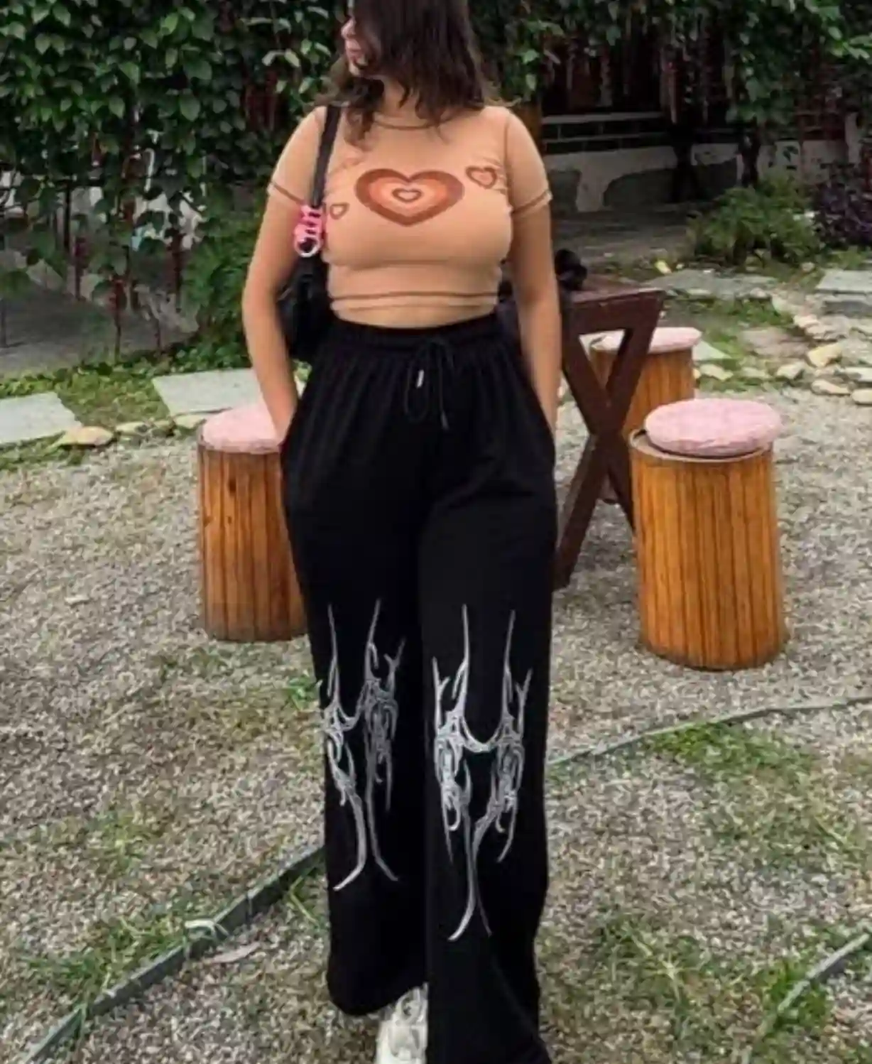 Black wide-leg sweatpants with white tribal graphic print