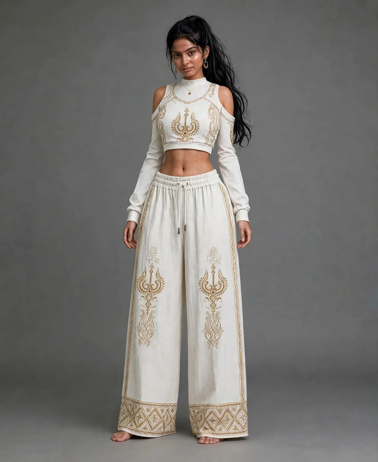 White wide-leg pants with gold print motifs and diamond hem border
