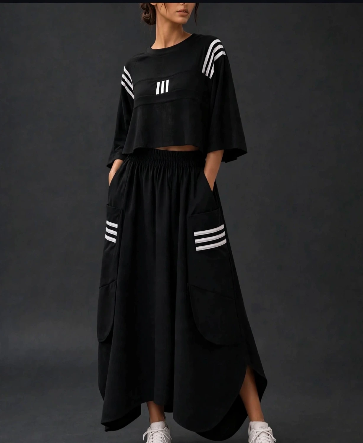 "Woman wearing black oversized crop top and wide-leg palazzo pants co-ord set with striped detailing"